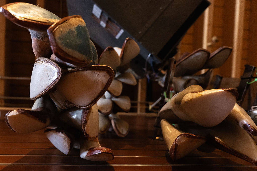 A close-up of a pile of boot lasts